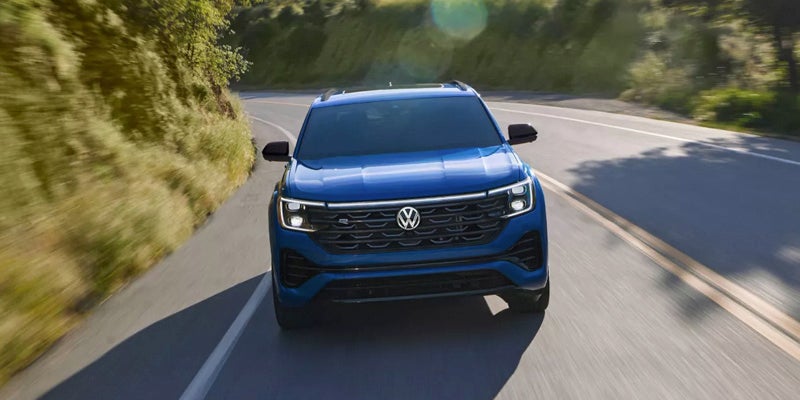 Blue SUV front driving shot