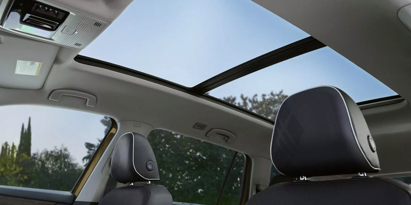 Panoramic sunroof view from inside a car