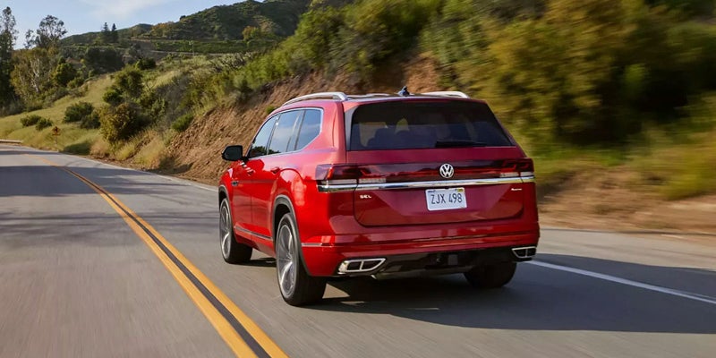 Red Volkswagen SUV driving on a highway