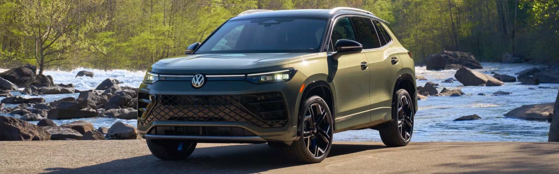 Rear view of green Volkswagen SUV on highway