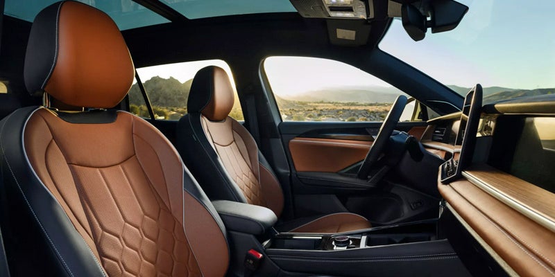 Premium brown leather front seats interior view