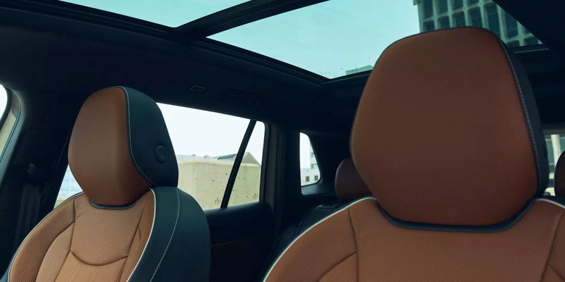 Car interior with panoramic sunroof and front seats