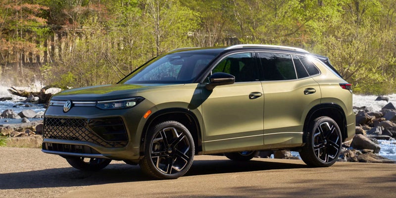 Green Volkswagen SUV side profile parked outdoors